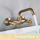 Antique Brass Wall-Mounted Basin Faucet – Dual Handles Swivel Spout BathroomLux